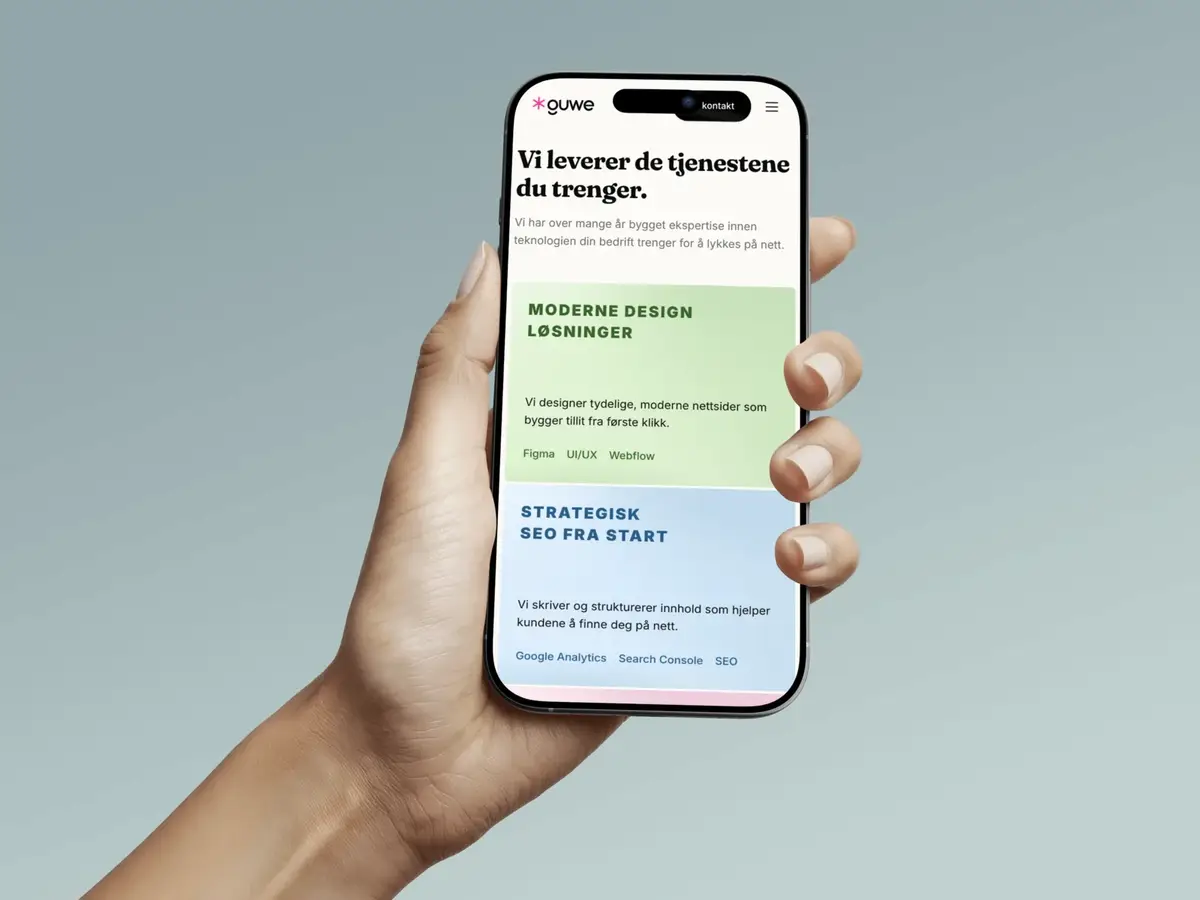 Guwe-nettsiden vist på en iPhone holdt i en hånd